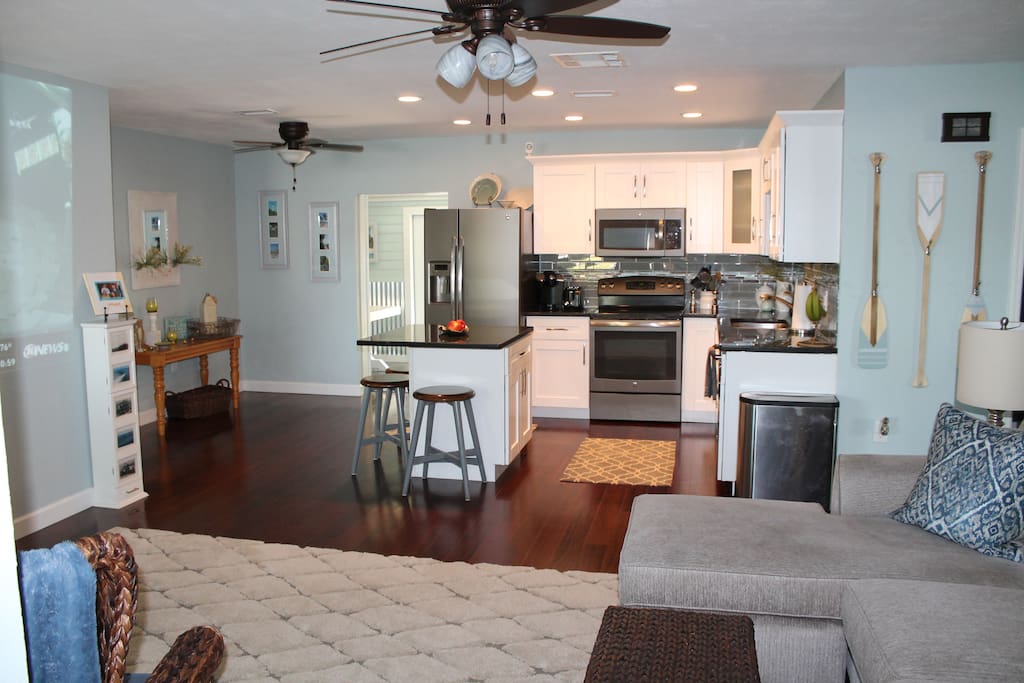 View from entry. Beautifully appointed kitchen complete with island seating.