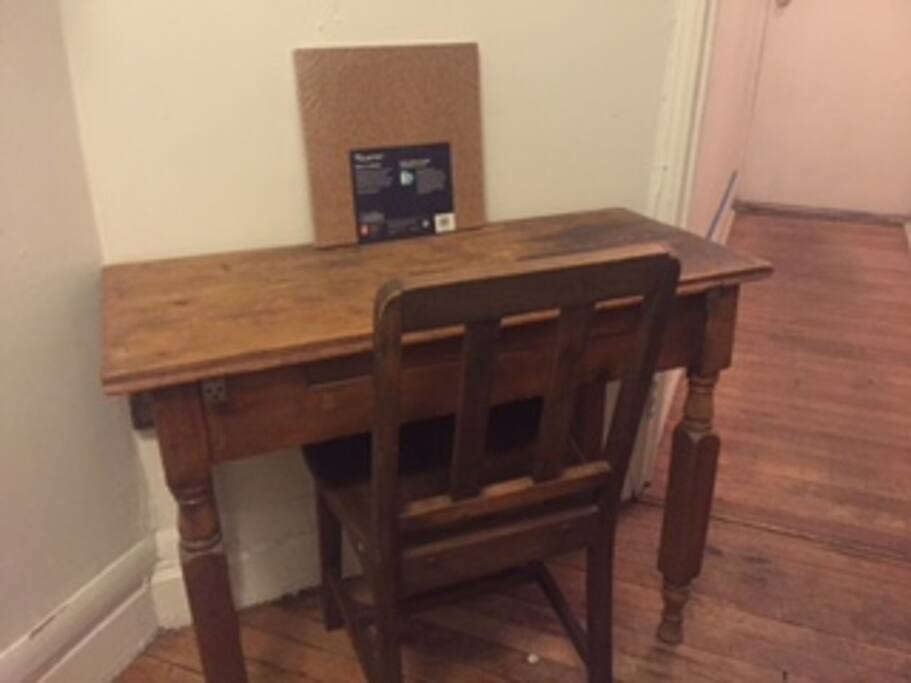 a desk where you can sit with your laptop or eat lunch.