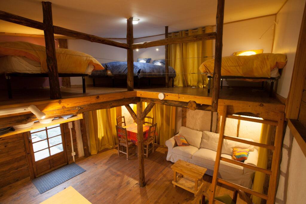 The mezzanine area, accessed by a fixed ladder, has four beds.