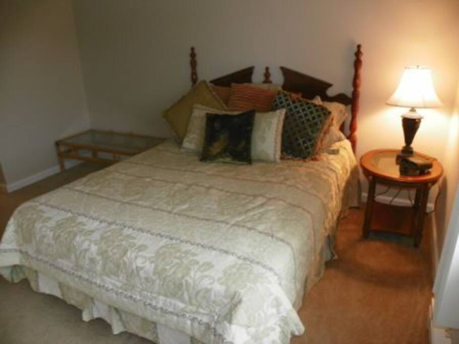queen bedroom with a washer dryer in the room for convienience