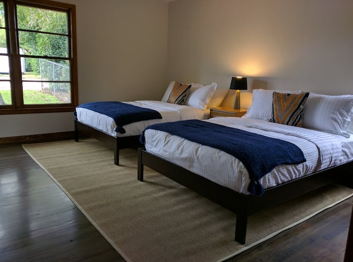 All the beds in the home are new...these are two full size beds in the room with the private bath