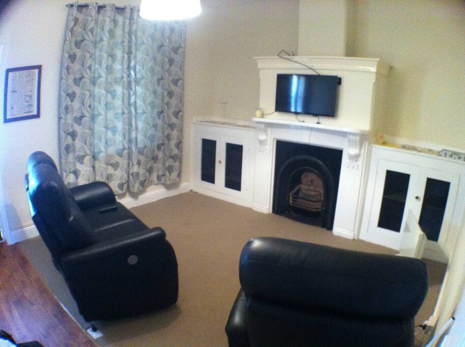 Lounge Room - electric reclining lounge chairs, DVD player and Television.