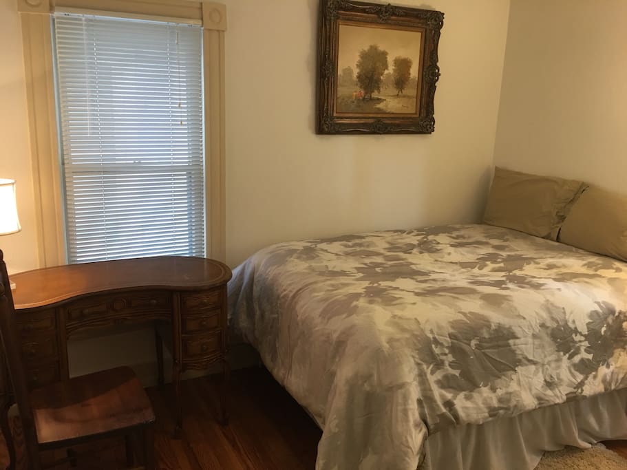 New bed, antique desk, quiet off street side room, everything you need!