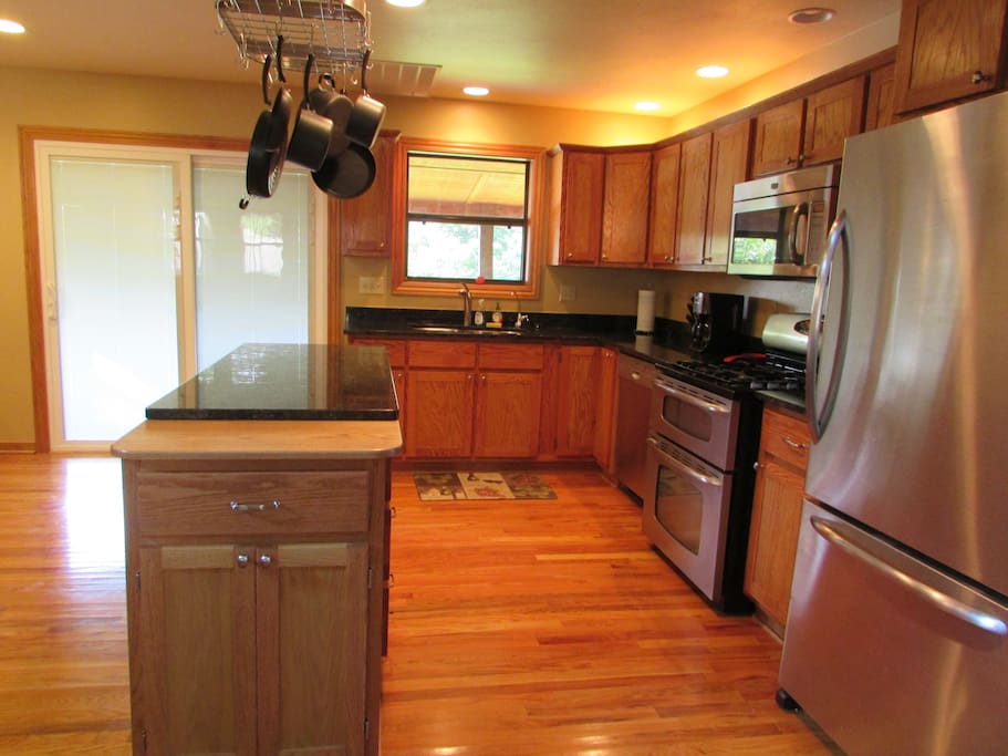 Well equipped kitchen with stainless steel appliances.