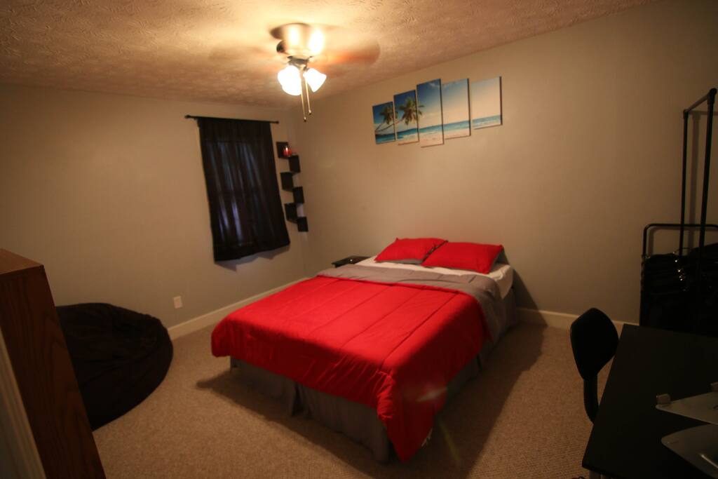 Bedroom 1: It has a great little work space, queen size bed, and giant bean bag chair to lounge in.