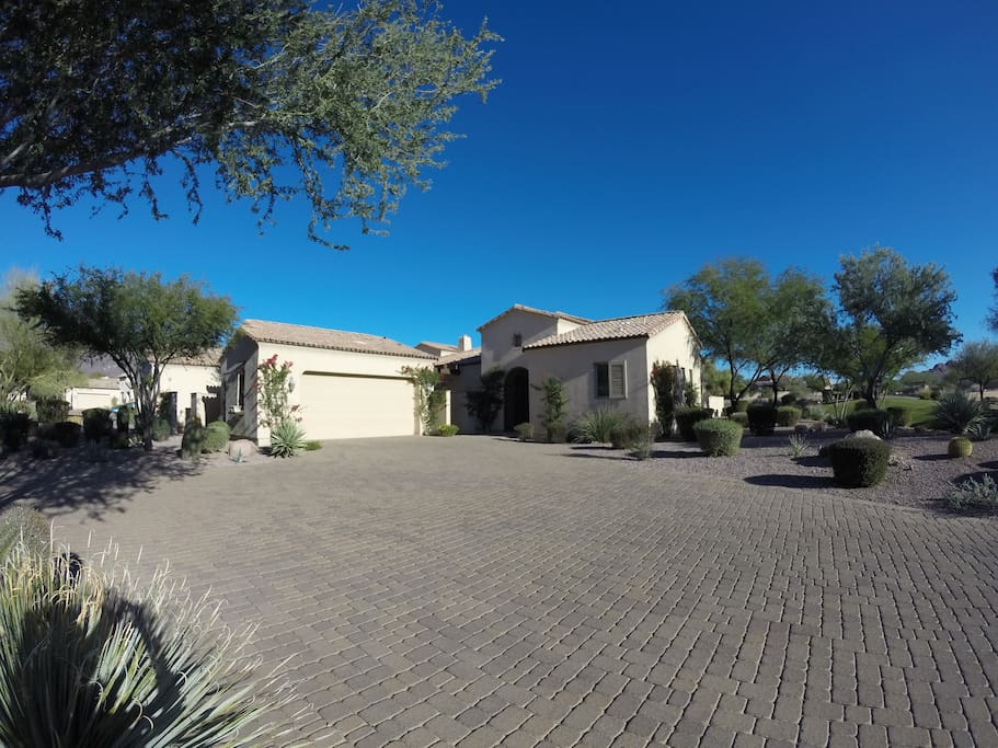 Front of house. On the right guest casita with a detached 2 car garage on the left.