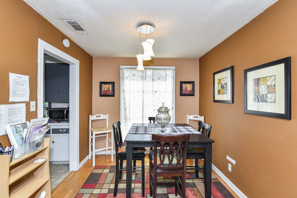 Bar height dining table seats 6. Large window has view of magnificent stadium.
