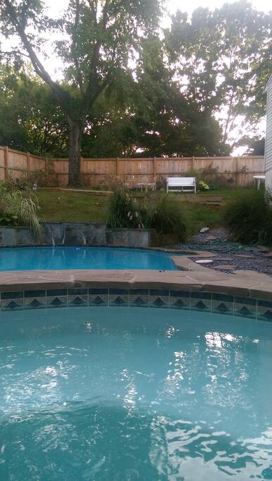 Back yard Oasis with Hot tub and pool with tanning and eating areas
