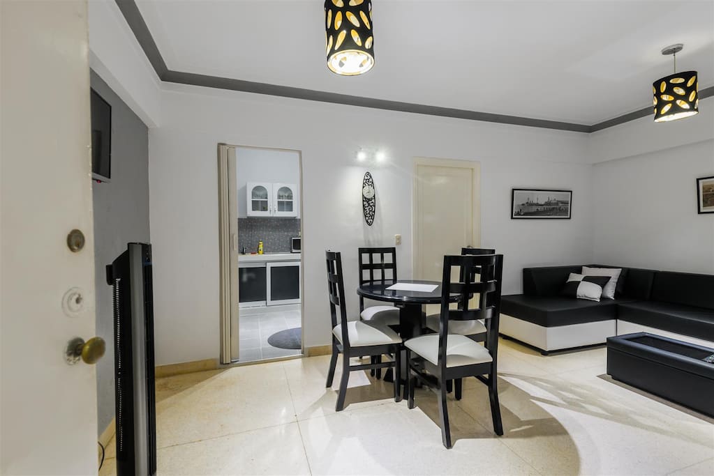entrance view, by the left the kitchen door, right closed door the bedroom access.