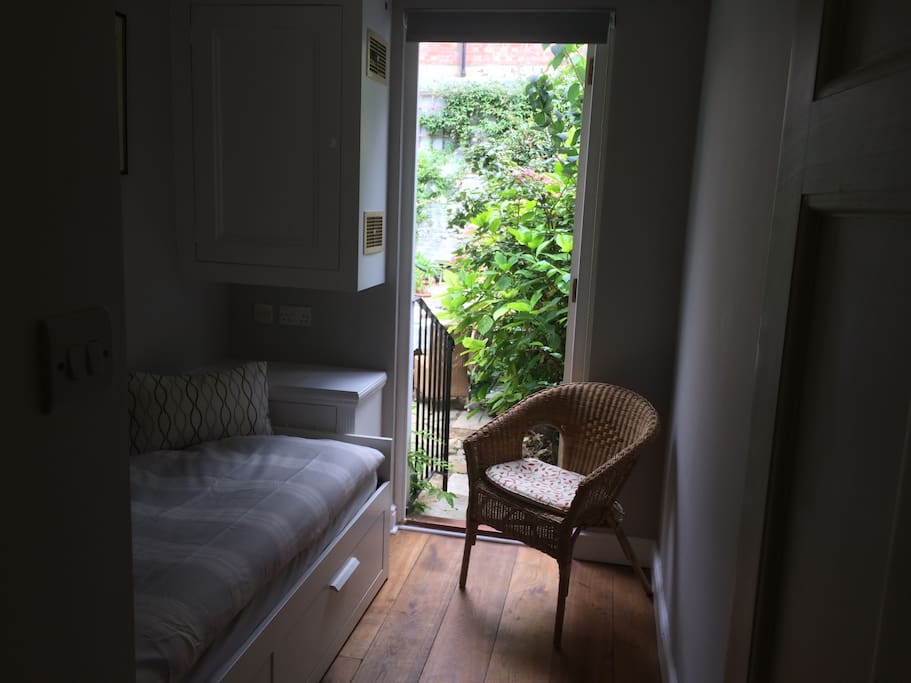 Small room door onto garden. Small toilet next door.