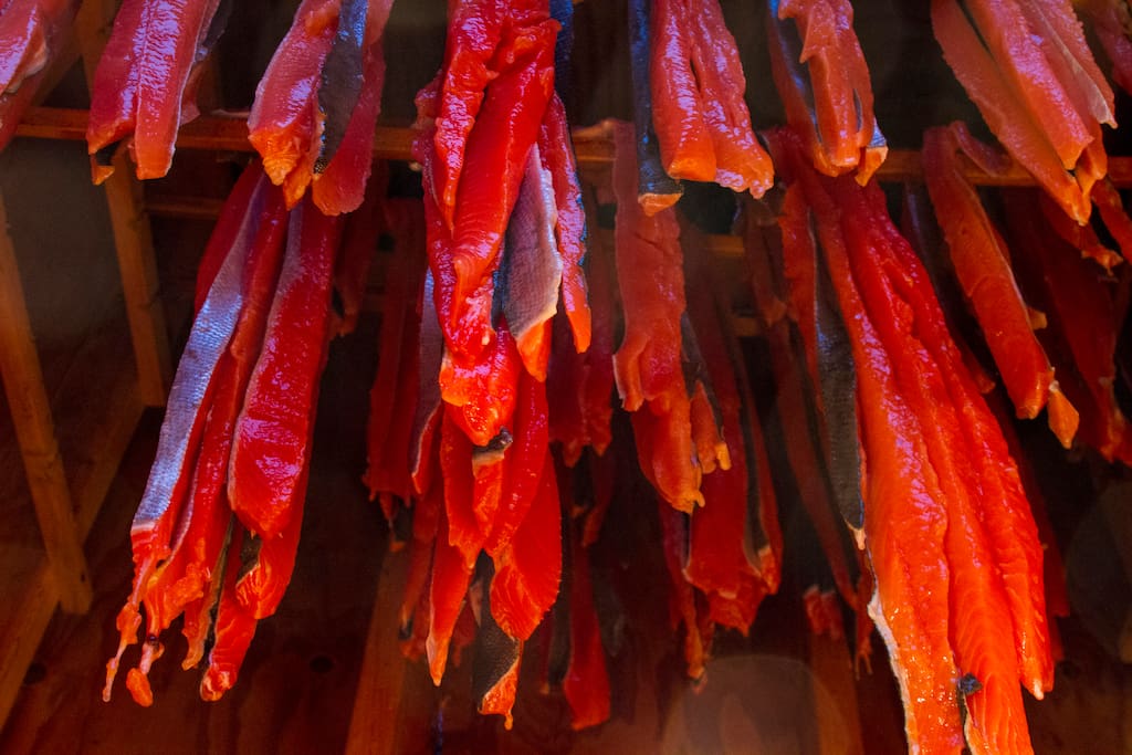 Salmon strips hanging in the smoke house