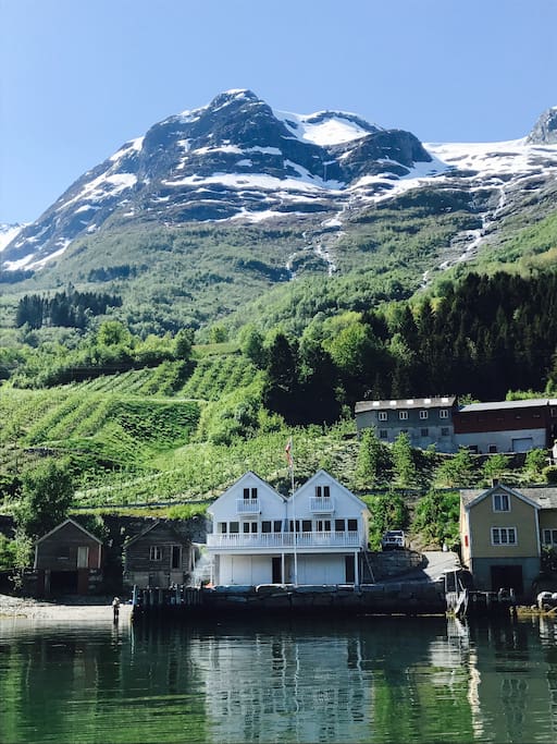 You will be renting the house to the left. Seen from the fjord.