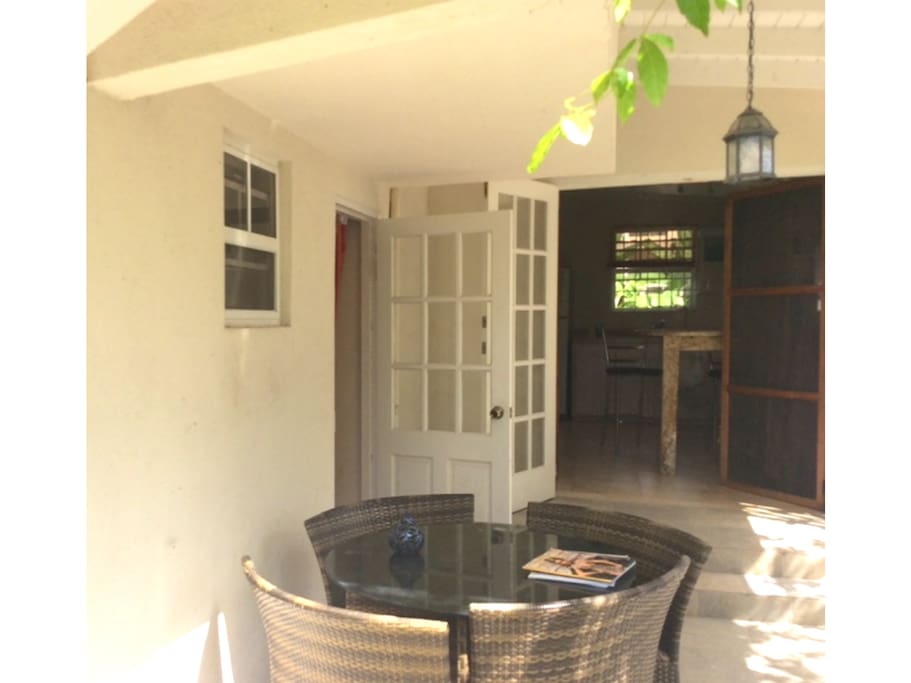 Private sunny gated patio with double doors leading to the kitchen and single door leading to the lounge