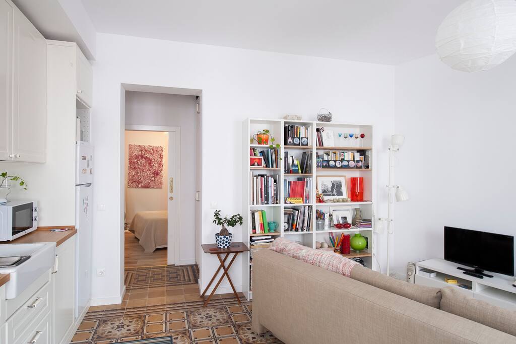 Sitting-room with double bed sofa and TV