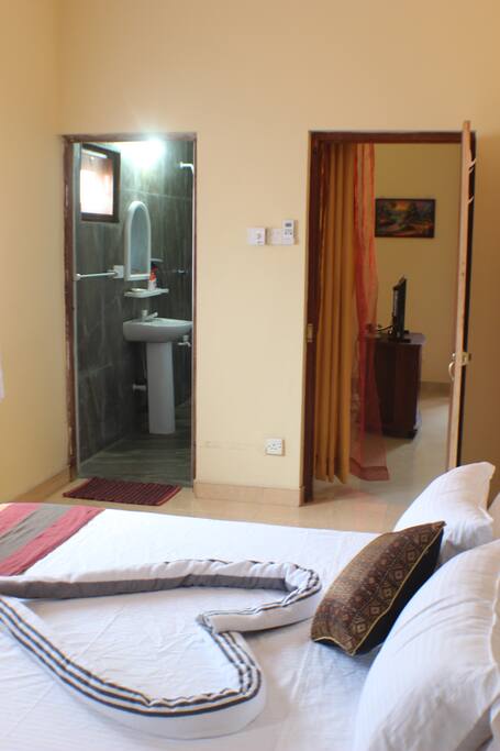 View of bedroom entrance door and the en-suite bathroom