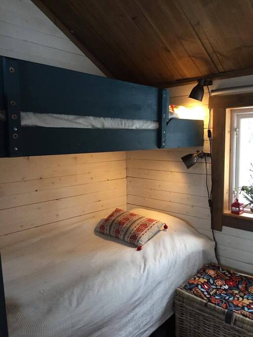 Bedroom 1, with two single beds and storage