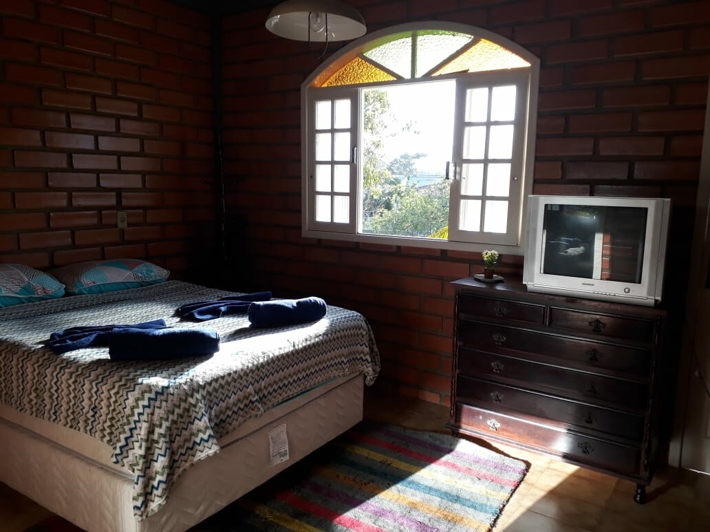 Bedroom 2 with:
- King size box bed
- Splitt air conditioner
- 42-inch TV