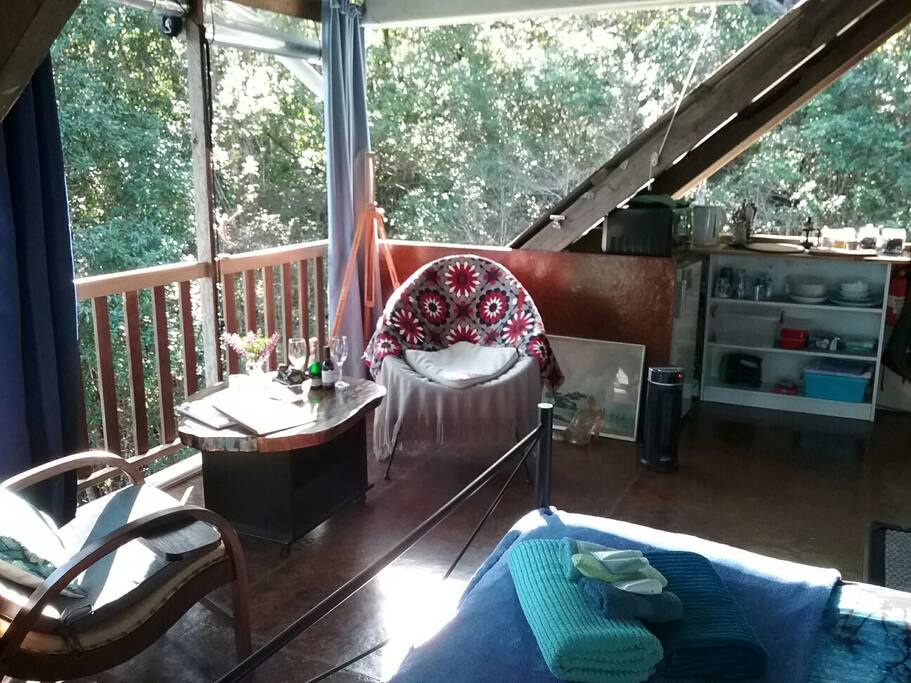 Winter sun shines in through the trees making the space warm and cozy. Plus there's a ceramic oscillating heater and electric blanket.