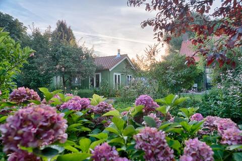 Cozy garden house with wood burning stove, sauna and hot tub