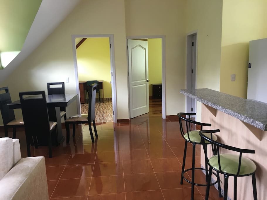Living room, diner area, and kitchen are all open to each other.