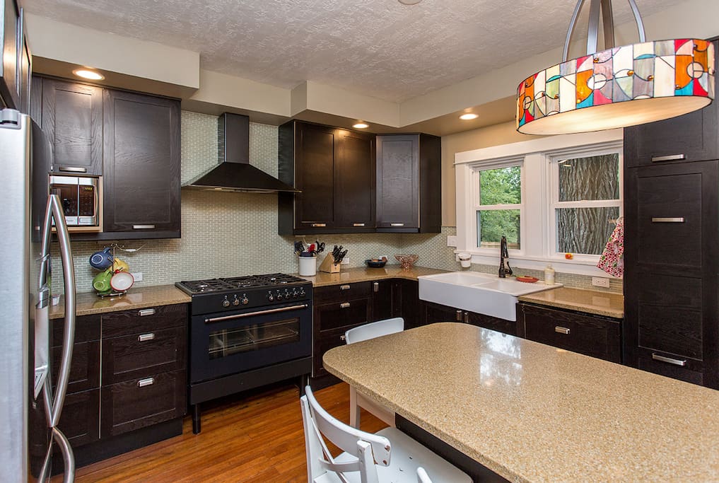 Updated kitchen with gas stove/range, dishwasher, fridfe/freezer, and microwave.