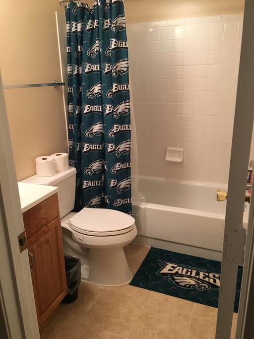 Bathroom with the basics. Shampoo, conditioner, body wash and towels.