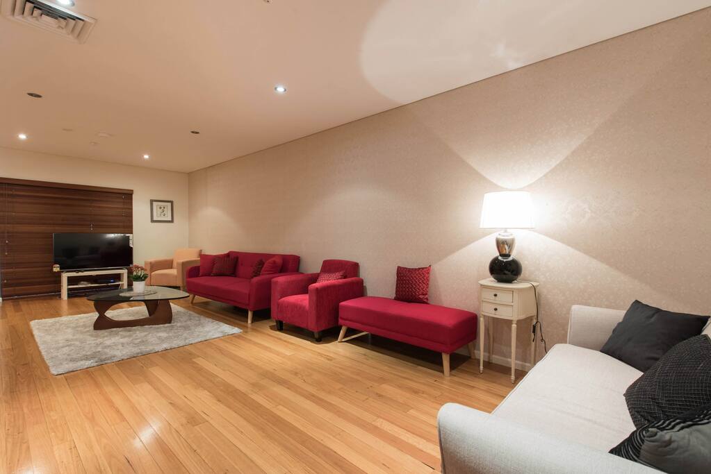Extra large living area with 55inch flat screen TV with Fetch TV.