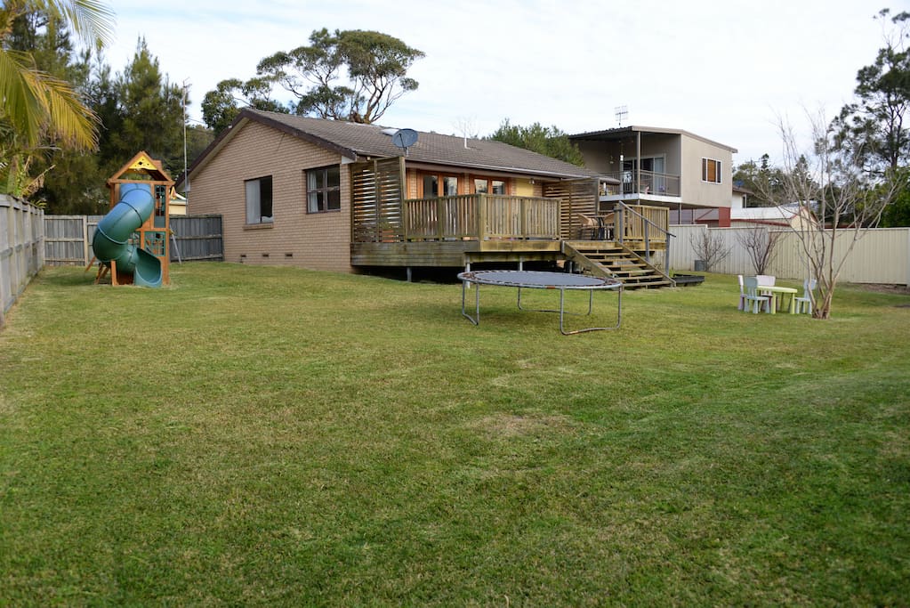 Large fenced flat backyard