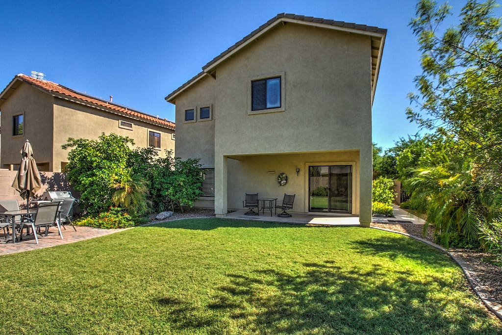 A spacious backyard provides the perfect space to run, play and barbecue under sunny Arizona skies!