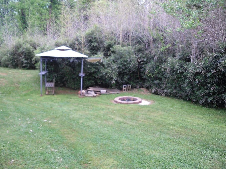 Fire pit area. Lawn chairs and outside chairs included