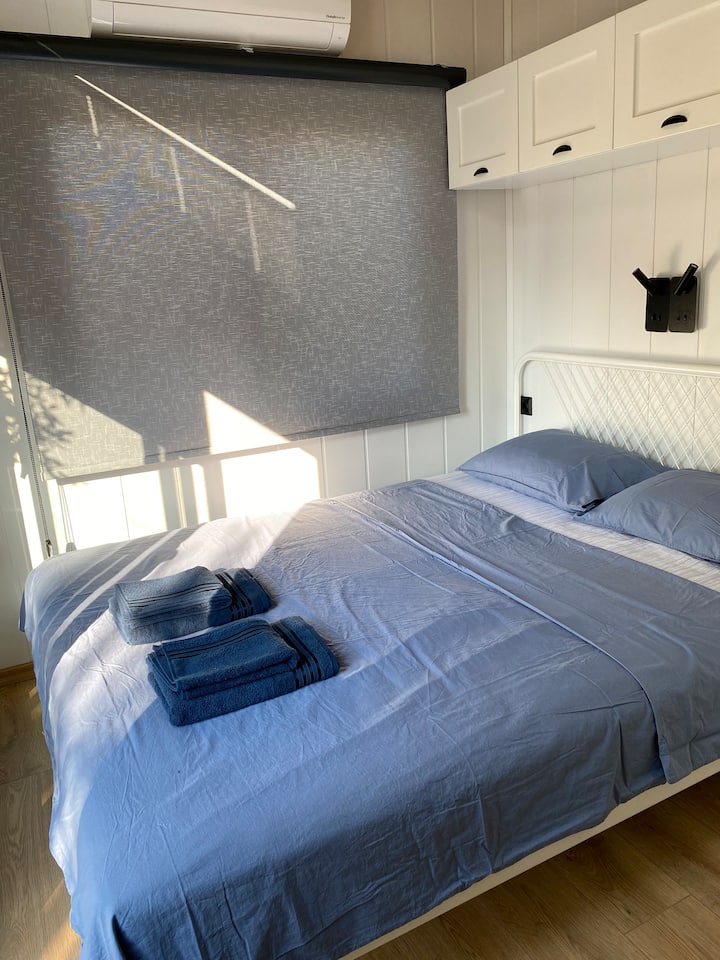Bedroom. All three houses have the same size bedrooms and have similar decor.