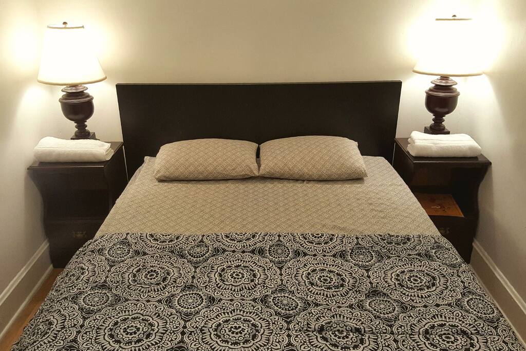 This is exactly how you will find your bedroom upon checking in. Sheets, blanket and towels are provided. Mattress is GREEN TEA MEMORY FOAM. There is a full sized mirror in your room!