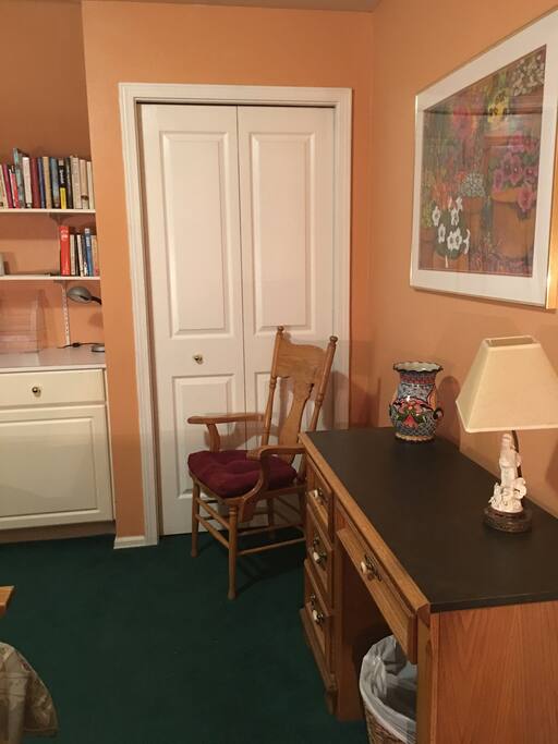 There are built-in drawers, a double closet and desk.