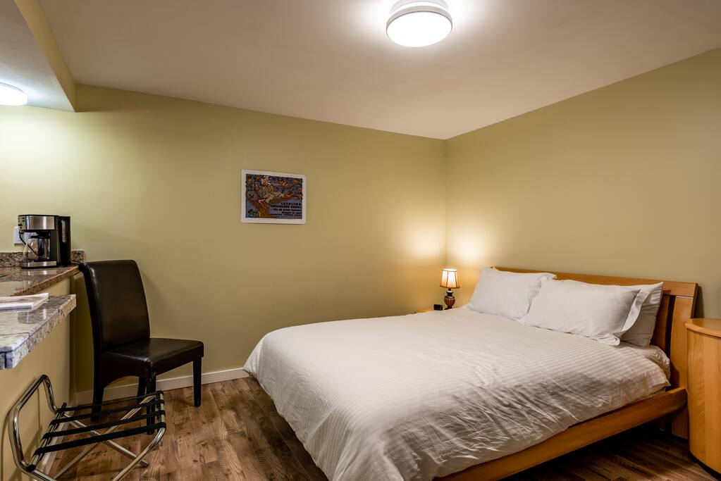Super comfy queen bed with lots of space around it for your stuff.