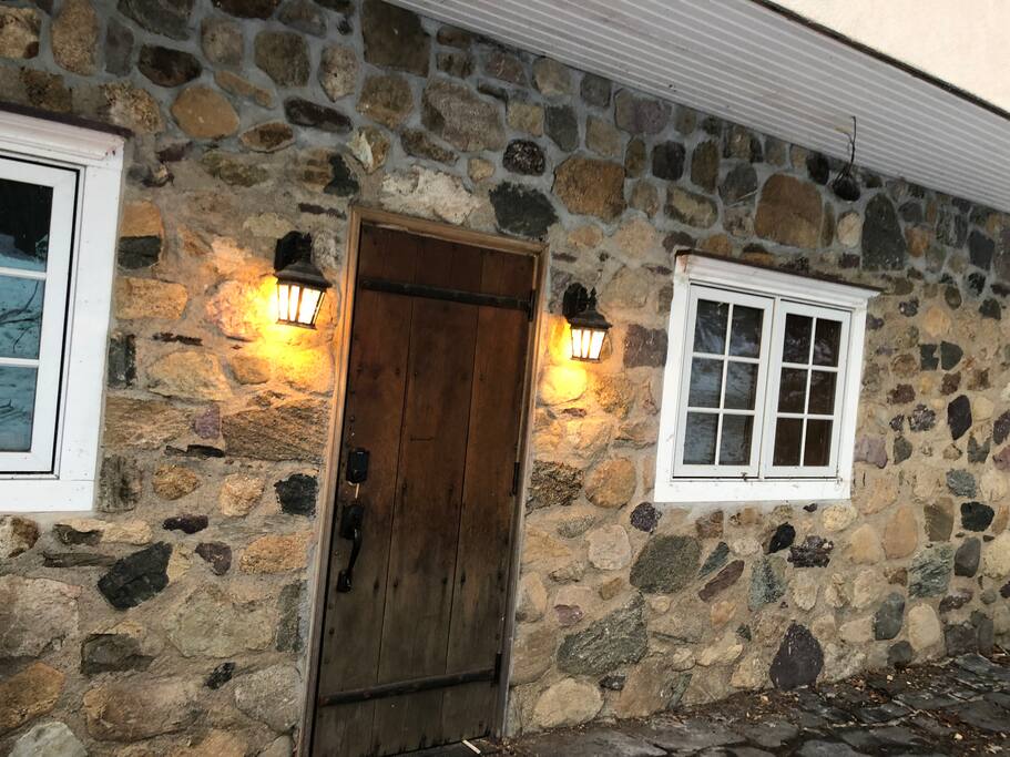 Your own private front entrance on slate patio. Walls are 14” thick fieldstone (not veneer)