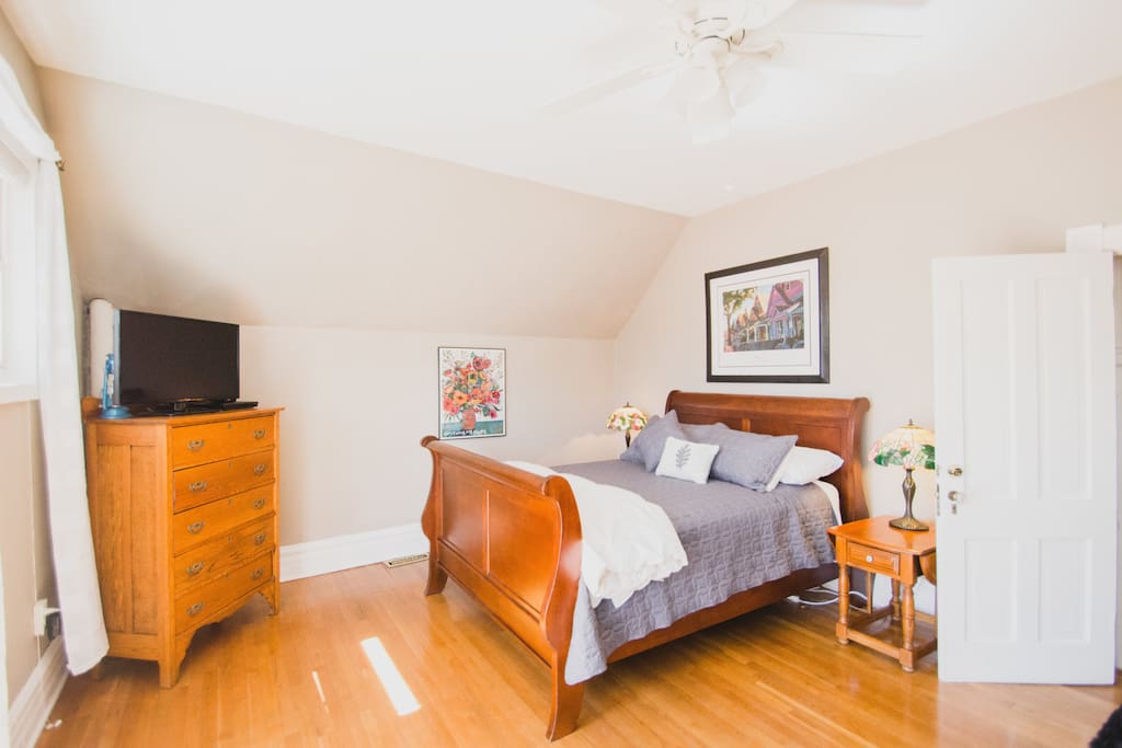Natural light and a comfy queen bed, plus television.