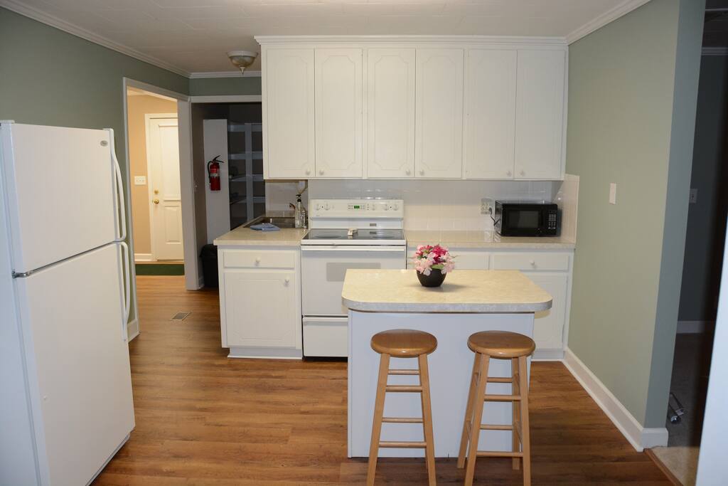 Kitchen includes refrigerator, microwave, dishwasher and stove. Space is shared with other guests.