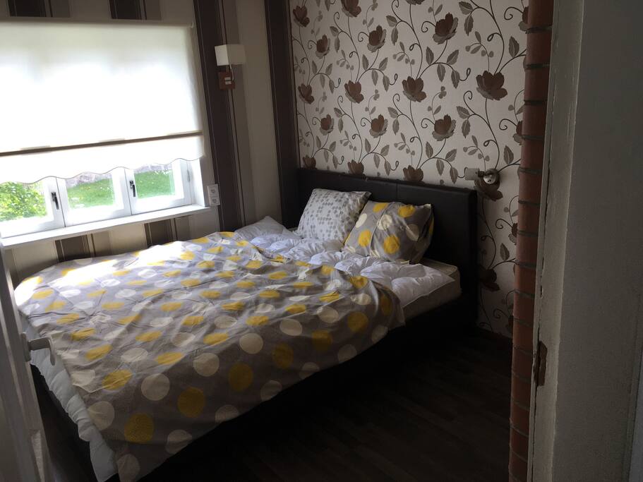 Bedroom with king size bed and big wardrobe