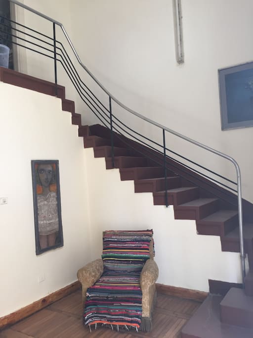 Staircase leading to the bedroom and bathroom