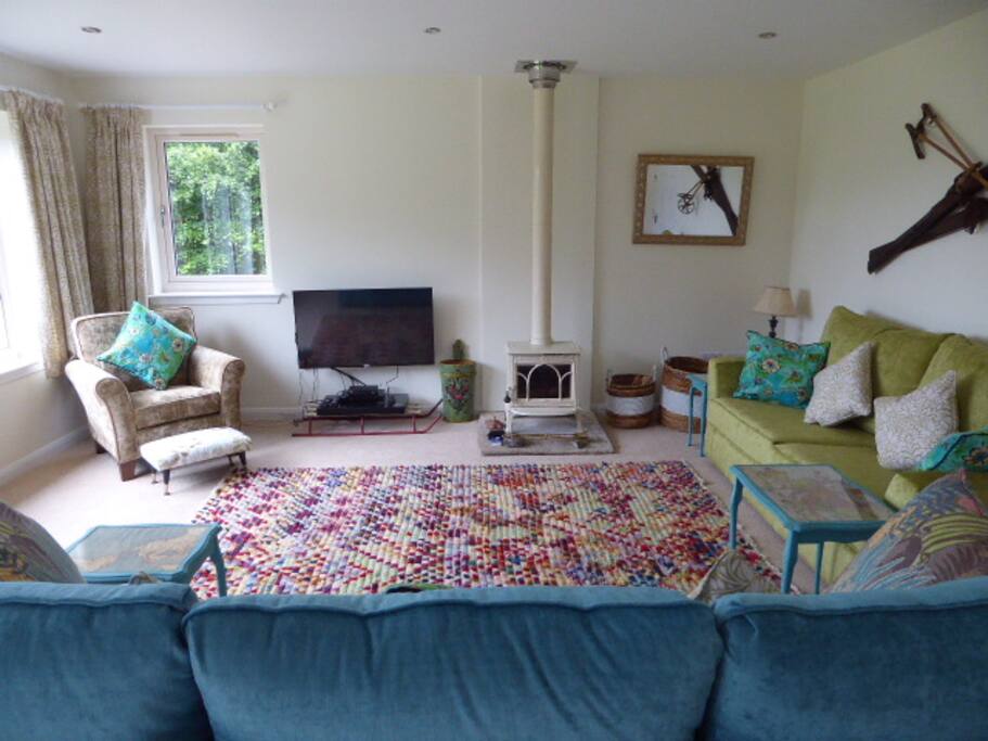 There's a wood-burning stove (logs supplied), plenty of comfy seating and a television and DVD player in the living room, plus books and games (not shown)