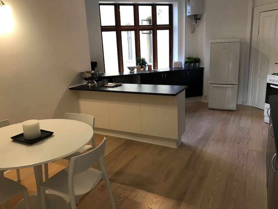 Big kitchen with dining area including dish washer and washing machine