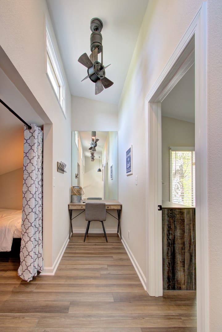 Upstairs Hallway With Vanity Area.
