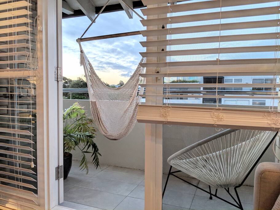 Sunset views from the hanging chair on the sun drenched balcony. Bliss.