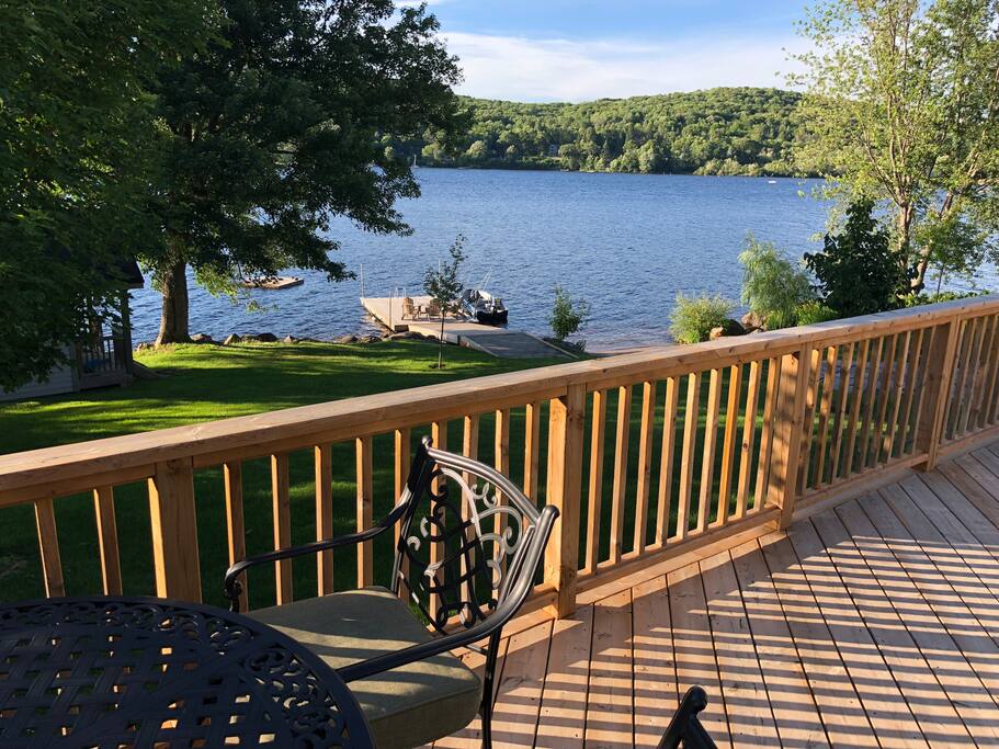 Actual view of lake from guest cottage deck, showing Little Doe Lake and dock for your use