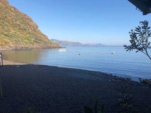 Typical aeolian house on the black sand beach