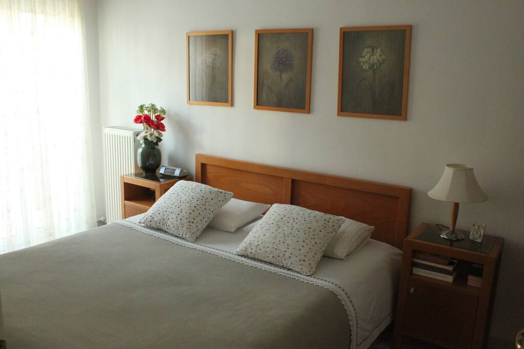 The bedroom with the double bed and the private balcony.