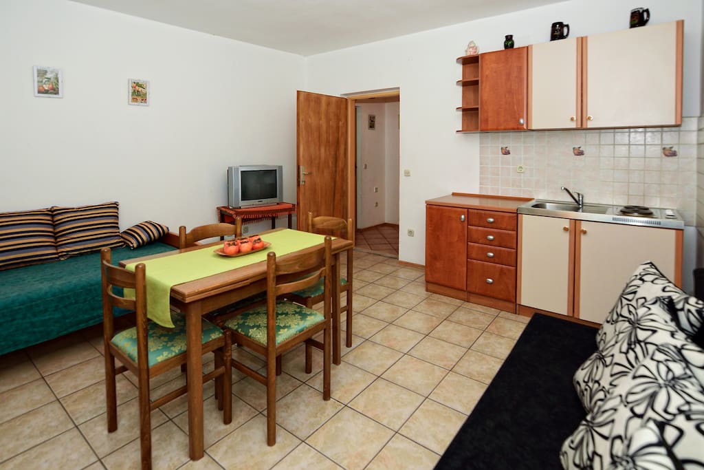 Kitchen with two additional bed.