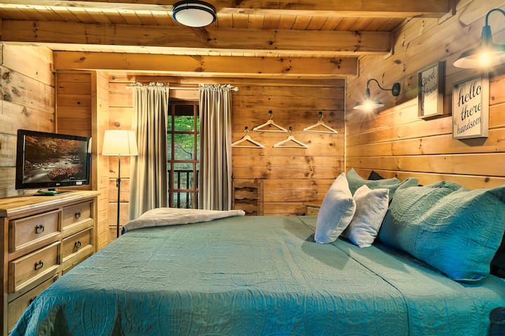 Main Level | Master Bedroom | King Sized Bed | Tub | Attached Bathroom | Deck Access Directly To Hot Tub |  Black out Curtains | Roku TV | Dresser for Clothes| 