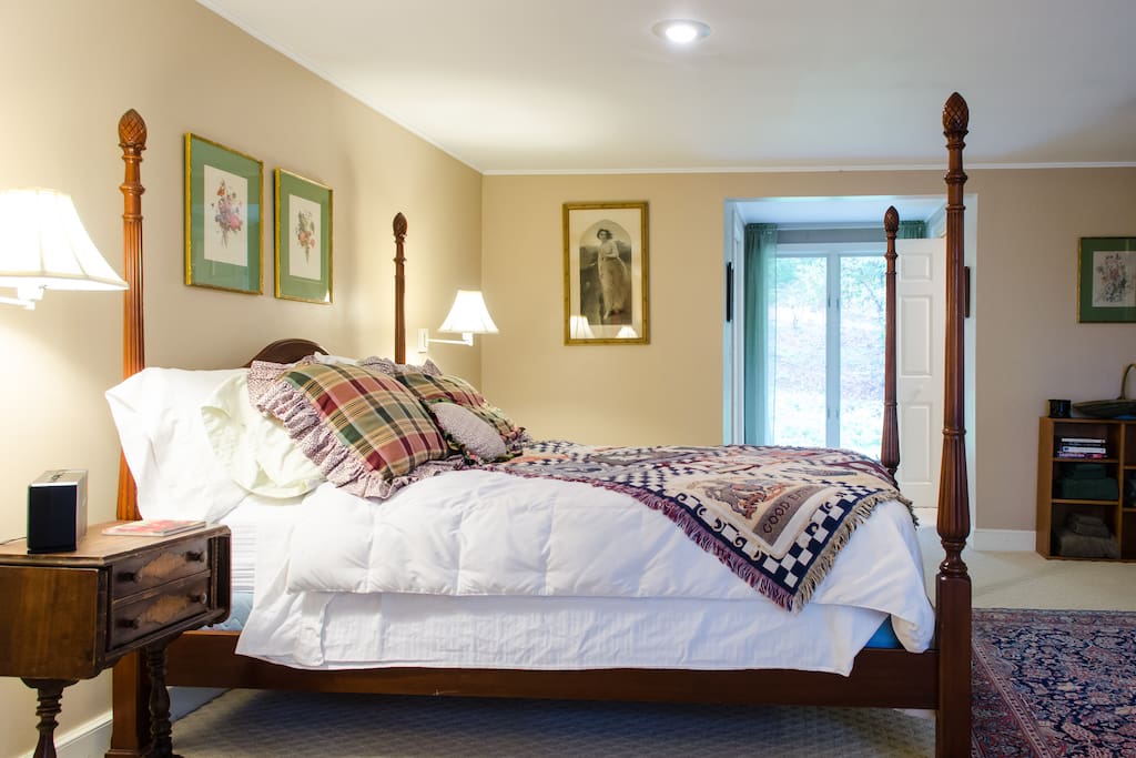 Queen bed in Master Bedroom facing East receives morning sunlight