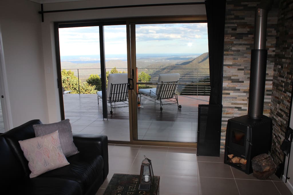 Separate lounge room with wood fire place. Exit directly onto the private deck area and panoramic views.